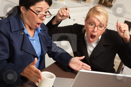 To use this stock image in your creative project, please select the size you need over to the right and click the "Add to Cart" button.
Your downloaded image will come with the Cutcaster watermark removed so don’t worry about the watermark you see on this page. Businesswomen Celebrate Success on the Laptop stock photo, Businesswomen Celebrate Success on the Laptop in the Kitchen. by Andy Dean