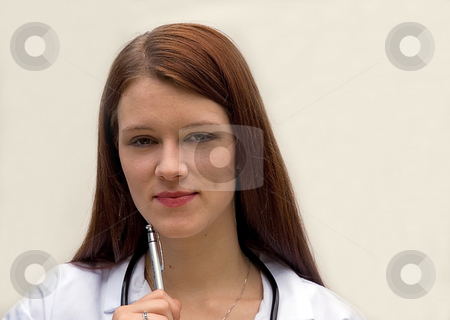 To use this stock image in your creative project, please select the size you need over to the right and click the "Add to Cart" button.
Your downloaded image will come with the Cutcaster watermark removed so don’t worry about the watermark you see on this page. Young Woman Medical Doctor stock photo, This young brunette Caucasian medical doctor is holding a pen and wearing a stethoscope against a light background. by Valerie Garner