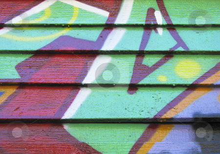 To use this stock image in your creative project, please select the size you need over to the right and click the "Add to Cart" button.
Your downloaded image will come with the Cutcaster watermark removed so don’t worry about the watermark you see on this page. Red & green design painted on wood wall stock photo, Red and green graffiti on wood slatted wall by Annette Davis