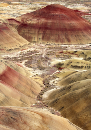 To use this stock image in your creative project, please select the size you need over to the right and click the "Add to Cart" button.
Your downloaded image will come with the Cutcaster watermark removed so don’t worry about the watermark you see on this page. Painted Hills stock photo, Oregon's Painted Hills living up to their colorful name, as iron and other minerals stain the clay covered hills. by Mike Dawson