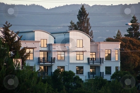 To use this stock image in your creative project, please select the size you need over to the right and click the "Add to Cart" button.
Your downloaded image will come with the Cutcaster watermark removed so don’t worry about the watermark you see on this page. Illuminated by sunset stock photo, Modern apartment building illuminated by sunset. by Mariusz Jurgielewicz