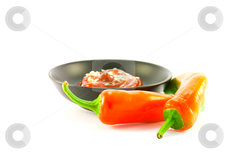 To use this stock image in your creative project, please select the size you need over to the right and click the "Add to Cart" button.
Your downloaded image will come with the Cutcaster watermark removed so don’t worry about the watermark you see on this page. Chillis with Bowl of Chili Sauce stock photo, Two red chillis with small black bowl of chili dipping sauce with clipping path on a white background by Keith Wilson