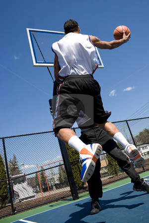 To use this stock image in your creative project, please select the size you need over to the right and click the "Add to Cart" button.
Your downloaded image will come with the Cutcaster watermark removed so don’t worry about the watermark you see on this page. Men Playing Basketball stock photo, A young basketball player driving to the hoop with some fancy moves during a one on one game at the park. by Todd Arena