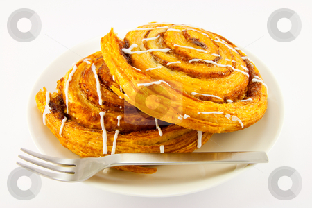 To use this stock image in your creative project, please select the size you need over to the right and click the "Add to Cart" button.
Your downloaded image will come with the Cutcaster watermark removed so don’t worry about the watermark you see on this page. Two Cinnamon Buns and Fork stock photo, Two cinnamon buns and fork with clipping path on a white background by Keith Wilson