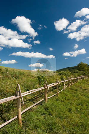 To use this stock image in your creative project, please select the size you need over to the right and click the "Add to Cart" button.
Your downloaded image will come with the Cutcaster watermark removed so don’t worry about the watermark you see on this page. East European summer landscape stock photo, East European summer landcape with wooden fence and beautiful clouds by Wiktor Bubniak