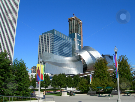 To use this stock image in your creative project, please select the size you need over to the right and click the "Add to Cart" button.
Your downloaded image will come with the Cutcaster watermark removed so don’t worry about the watermark you see on this page. Chicago Millennium Park Theater stock photo, Famous Chicago Millennium Park Theater, surrounded by downtown buildings by Daniela Mangiuca