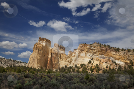 To use this stock image in your creative project, please select the size you need over to the right and click the "Add to Cart" button.
Your downloaded image will come with the Cutcaster watermark removed so don’t worry about the watermark you see on this page. Kodachrome Basin stock photo, View of red rock formations in San Rafael Swell with blue sky by Mark Smith