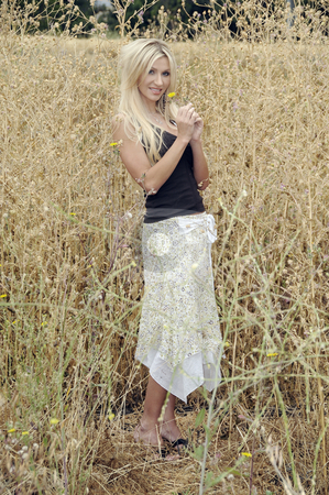 To use this stock image in your creative project, please select the size you need over to the right and click the "Add to Cart" button.
Your downloaded image will come with the Cutcaster watermark removed so don’t worry about the watermark you see on this page. Woman in Field stock photo, A beautiful woman in a field by Timothy OLeary