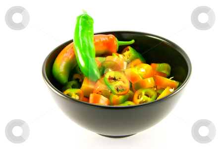 To use this stock image in your creative project, please select the size you need over to the right and click the "Add to Cart" button.
Your downloaded image will come with the Cutcaster watermark removed so don’t worry about the watermark you see on this page. Chillis stock photo, Two chillis and chopped chillis in a black bowl with clipping path on a white background by Keith Wilson