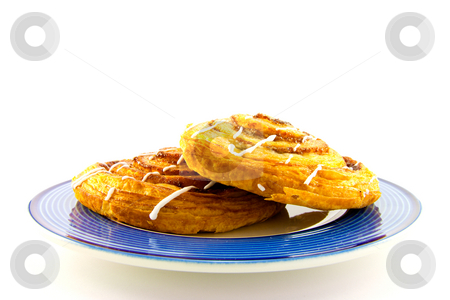 To use this stock image in your creative project, please select the size you need over to the right and click the "Add to Cart" button.
Your downloaded image will come with the Cutcaster watermark removed so don’t worry about the watermark you see on this page. Cinnamon Buns on a Blue Plate stock photo, Two cinnamon buns on a blue plate with clipping path on a white background by Keith Wilson
