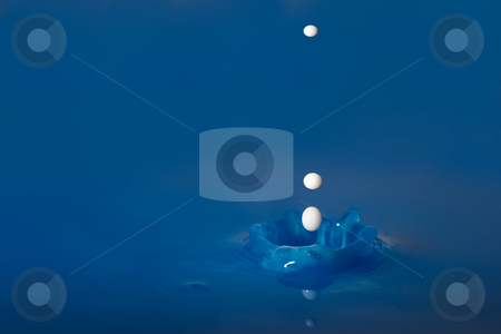 To use this stock image in your creative project, please select the size you need over to the right and click the "Add to Cart" button.
Your downloaded image will come with the Cutcaster watermark removed so don’t worry about the watermark you see on this page. White droplets falling into the blue stock photo, White droplets falling in blue colered water by Dirk Ercken