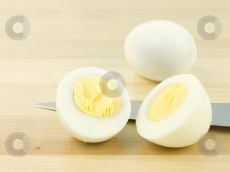 To use this stock image in your creative project, please select the size you need over to the right and click the "Add to Cart" button.
Your downloaded image will come with the Cutcaster watermark removed so don’t worry about the watermark you see on this page. Sliced Egg with Knife stock photo, Sliced egg with knife on a wooden background by John Teeter