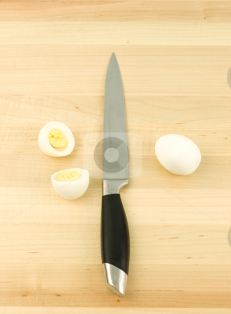 To use this stock image in your creative project, please select the size you need over to the right and click the "Add to Cart" button.
Your downloaded image will come with the Cutcaster watermark removed so don’t worry about the watermark you see on this page. Sliced Egg with Knife stock photo, Sliced egg with knife on a wooden background by John Teeter