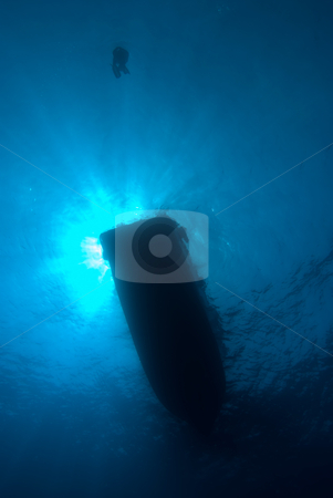 To use this stock image in your creative project, please select the size you need over to the right and click the "Add to Cart" button.
Your downloaded image will come with the Cutcaster watermark removed so don’t worry about the watermark you see on this page. A silhouette of a diver waiting for a dive boat stock photo, A silhouette of a diver waiting for a dive boat,underneath view. Red Sea, Egypt. by Mark Doherty