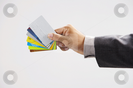 To use this stock image in your creative project, please select the size you need over to the right and click the "Add to Cart" button.
Your downloaded image will come with the Cutcaster watermark removed so don’t worry about the watermark you see on this page. Man showing few credit cards stock photo, Man showing few credit cards with white background by eskaylim