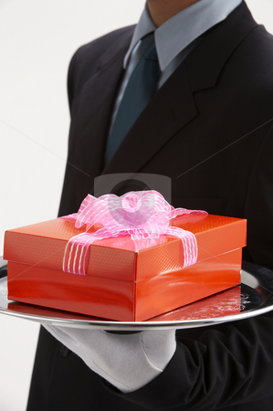 To use this stock image in your creative project, please select the size you need over to the right and click the "Add to Cart" button.
Your downloaded image will come with the Cutcaster watermark removed so don’t worry about the watermark you see on this page. Man holding a present stock photo, Man holding exclusive presents to someone special by eskaylim