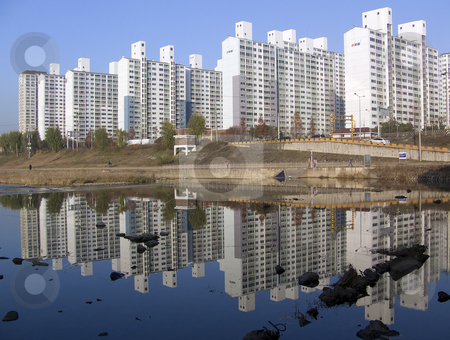 To use this stock image in your creative project, please select the size you need over to the right and click the "Add to Cart" button.
Your downloaded image will come with the Cutcaster watermark removed so don’t worry about the watermark you see on this page. Korean Buildings stock photo, Typical apartment buildings in South Korea by Jennifer Vey