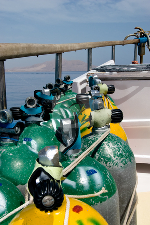 To use this stock image in your creative project, please select the size you need over to the right and click the "Add to Cart" button.
Your downloaded image will come with the Cutcaster watermark removed so don’t worry about the watermark you see on this page. Scuba diving tanks secured to the side of a boat stock photo, Scuba diving tanks secured to the side of a boat. Red Sea, Egypt. by Mark Doherty