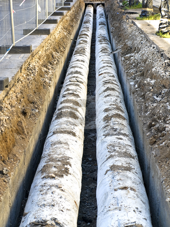 To use this stock image in your creative project, please select the size you need over to the right and click the "Add to Cart" button.
Your downloaded image will come with the Cutcaster watermark removed so don’t worry about the watermark you see on this page. Pipes stock photo, Two water pipes in the trench by Sergej Razvodovskij