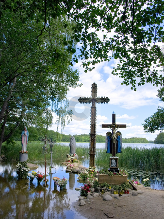 To use this stock image in your creative project, please select the size you need over to the right and click the "Add to Cart" button.
Your downloaded image will come with the Cutcaster watermark removed so don’t worry about the watermark you see on this page. Roods stock photo, Pilgrimage place with the roods in the water by Sergej Razvodovskij