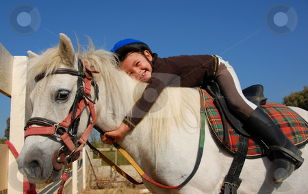 To use this stock image in your creative project, please select the size you need over to the right and click the "Add to Cart" button.
Your downloaded image will come with the Cutcaster watermark removed so don’t worry about the watermark you see on this page. Little girl and shetland pony stock photo, Little girl and her best friend white shetland pony by Bonzami Emmanuelle
