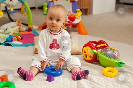 To use this stock image in your creative project, please select the size you need over to the right and click the "Add to Cart" button.
Your downloaded image will come with the Cutcaster watermark removed so don’t worry about the watermark you see on this page. Playmat stock photo, Caucasian baby girl playing on a floor. by Mariusz Jurgielewicz