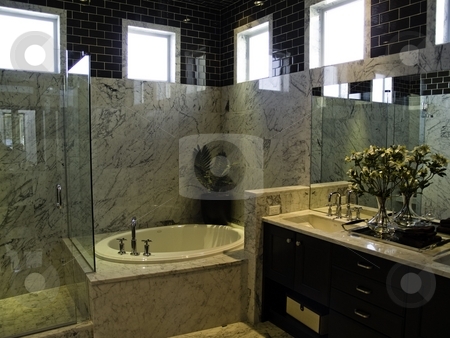 To use this stock image in your creative project, please select the size you need over to the right and click the "Add to Cart" button.
Your downloaded image will come with the Cutcaster watermark removed so don’t worry about the watermark you see on this page. Bathroom stock photo, An elegant modern bathroom with marble by Cora Reed