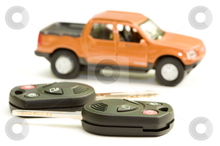 To use this stock image in your creative project, please select the size you need over to the right and click the "Add to Cart" button.
Your downloaded image will come with the Cutcaster watermark removed so don’t worry about the watermark you see on this page. Car key stock photo, Macro picture of car key with truck as the background by Hieng Ling Tie