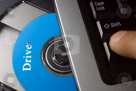 To use this stock image in your creative project, please select the size you need over to the right and click the "Add to Cart" button.
Your downloaded image will come with the Cutcaster watermark removed so don’t worry about the watermark you see on this page. Laptop with driver disc stock photo, Laptop with open CD holder , driver disc by Vladyslav Danilin