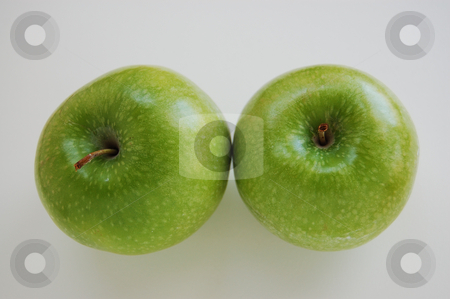 To use this stock image in your creative project, please select the size you need over to the right and click the "Add to Cart" button.
Your downloaded image will come with the Cutcaster watermark removed so don’t worry about the watermark you see on this page. Apple Duo stock photo, Two green apples sitting on isolated white background. by Tina Kim