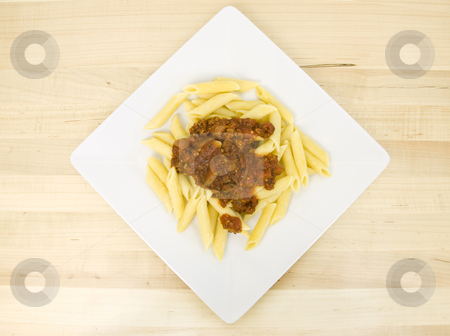 To use this stock image in your creative project, please select the size you need over to the right and click the "Add to Cart" button.
Your downloaded image will come with the Cutcaster watermark removed so don’t worry about the watermark you see on this page. Mostacolli with spaghetti sauce stock photo, Mostacolli with spaghetti sauce on a white plate by John Teeter