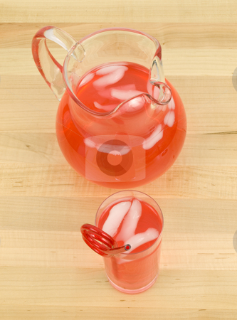 To use this stock image in your creative project, please select the size you need over to the right and click the "Add to Cart" button.
Your downloaded image will come with the Cutcaster watermark removed so don’t worry about the watermark you see on this page. Juice in Glass and Pitcher stock photo, Juice in Glass and Pitcher on wooden background by John Teeter
