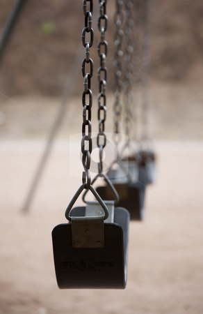 To use this stock image in your creative project, please select the size you need over to the right and click the "Add to Cart" button.
Your downloaded image will come with the Cutcaster watermark removed so don’t worry about the watermark you see on this page. Playground Swings stock photo, Old style playground swing with chains and rubber seat by Scott Griessel