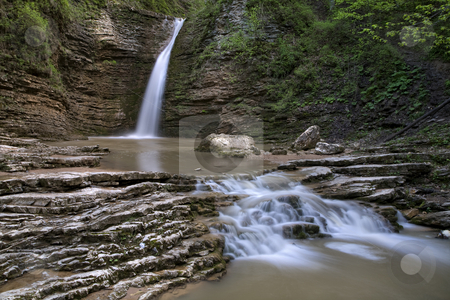 To use this stock image in your creative project, please select the size you need over to the right and click the "Add to Cart" button.
Your downloaded image will come with the Cutcaster watermark removed so don’t worry about the watermark you see on this page. Waterfalls on a mountain river stock photo, small cascade of waterfalls on a mountain river by Valery Kraynov
