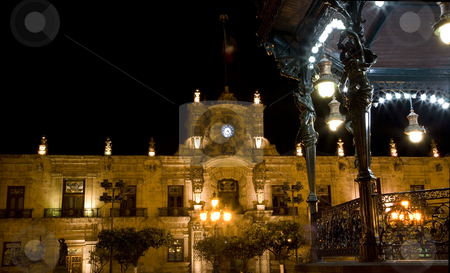 To use this stock image in your creative project, please select the size you need over to the right and click the "Add to Cart" button.
Your downloaded image will come with the Cutcaster watermark removed so don’t worry about the watermark you see on this page. Government Palace Guadalajara Mexico at Night stock photo, Governnment Palace Guadalajara Mexico at Night Taken from Park with Band Stand in foreground by William Perry