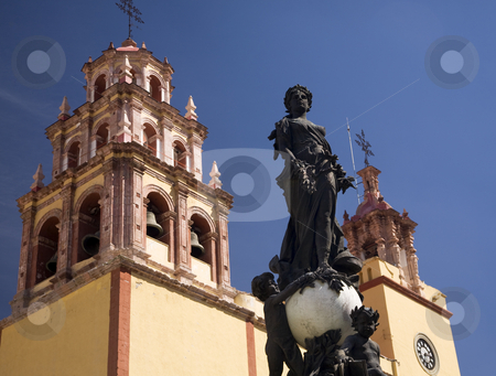 To use this stock image in your creative project, please select the size you need over to the right and click the "Add to Cart" button.
Your downloaded image will come with the Cutcaster watermark removed so don’t worry about the watermark you see on this page. Peace Statue Basilica Guanajuato Mexico stock photo, Peace Statue Donated To City by Charles V, Holy Roman Emperor, in the 1500s, Steeple, Towers, Bells, Basilica of our Lady of Guanajuato, Basilica de Nusetra Senora Guanajuato, Mexico by William Perry