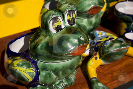 To use this stock image in your creative project, please select the size you need over to the right and click the "Add to Cart" button.
Your downloaded image will come with the Cutcaster watermark removed so don’t worry about the watermark you see on this page. Ceramic Frogs Guanajuato Mexico stock photo, Mexican Ceramic Frog, Yellow Wall, Guanajuato, Mexico. Guanajuato is known as the Frogs Place for the mountains around the city that look like frogs. by William Perry