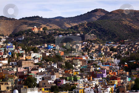 To use this stock image in your creative project, please select the size you need over to the right and click the "Add to Cart" button.
Your downloaded image will come with the Cutcaster watermark removed so don’t worry about the watermark you see on this page. Colored Houses, Valencia Silver Mine, Guanajuato, Mexico stock photo, Colored Houses with Valencia Silver Mine in distance, Guanajuato, Mexico taked from El Pipilia Overlook by William Perry