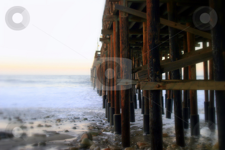 To use this stock image in your creative project, please select the size you need over to the right and click the "Add to Cart" button.
Your downloaded image will come with the Cutcaster watermark removed so don’t worry about the watermark you see on this page. Ocean Wave Storm Pier stock photo, Ocean waves throughout at storm crashing into a wooden pier. by Henrik Lehnerer