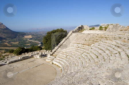 To use this stock image in your creative project, please select the size you need over to the right and click the "Add to Cart" button.
Your downloaded image will come with the Cutcaster watermark removed so don’t worry about the watermark you see on this page. The Theater of Segesta in Sicily stock photo, The Theater of Segesta (3th century BC) dominates the valley; Sicily, Italy by Roberto Marinello