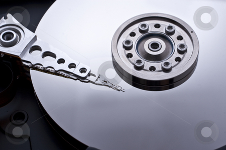 To use this stock image in your creative project, please select the size you need over to the right and click the "Add to Cart" button.
Your downloaded image will come with the Cutcaster watermark removed so don’t worry about the watermark you see on this page. Hard drive inside details stock photo, Closeup and macro view of hard drive inside by Kenneth Ro