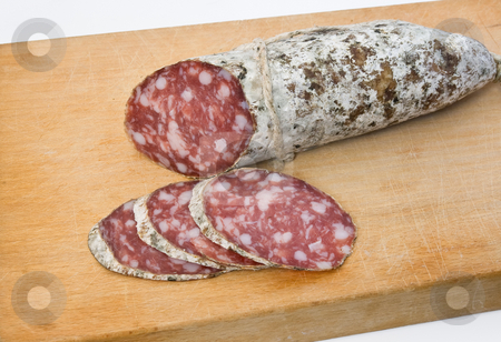 To use this stock image in your creative project, please select the size you need over to the right and click the "Add to Cart" button.
Your downloaded image will come with the Cutcaster watermark removed so don’t worry about the watermark you see on this page. Salami on board stock photo, Salami sliced on cutting board by ANTONIO SCARPI