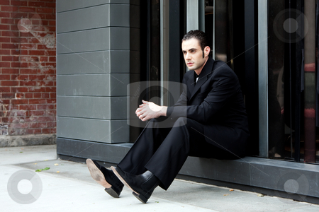 To use this stock image in your creative project, please select the size you need over to the right and click the "Add to Cart" button.
Your downloaded image will come with the Cutcaster watermark removed so don’t worry about the watermark you see on this page. Business man sitting stock photo, Handsome Caucasian business man in black suit sitting on street in front of a modern building by Paul Hakimata