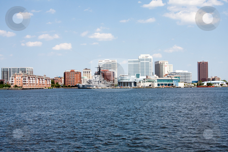 To use this stock image in your creative project, please select the size you need over to the right and click the "Add to Cart" button.
Your downloaded image will come with the Cutcaster watermark removed so don’t worry about the watermark you see on this page. Norfolk, VA Skyline stock photo, The skyline of Norfolk, Virginia on a nice summer day seen from Craford Bay. Tall buildings and Nauticus marine terminal and museum, and the US Navy battleship USS Wisconsin (BB-64) in it's harbor port. by Paul Hakimata