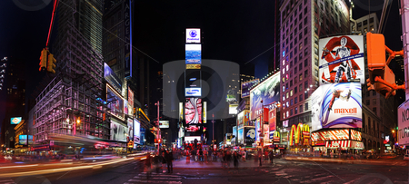To use this stock image in your creative project, please select the size you need over to the right and click the "Add to Cart" button.
Your downloaded image will come with the Cutcaster watermark removed so don’t worry about the watermark you see on this page. Times Square by night stock photo, Night scene of Times Square in Manhattan (New York City) with all the lit up billboards and advertisements by Paul Hakimata