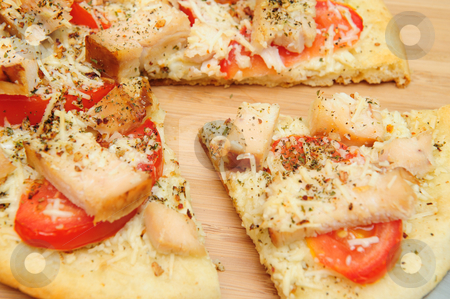 To use this stock image in your creative project, please select the size you need over to the right and click the "Add to Cart" button.
Your downloaded image will come with the Cutcaster watermark removed so don’t worry about the watermark you see on this page. Chicken Pizza For One stock photo, A slice of grilled chicken, fresh tomatoes, garlic and grated Asiago cheese top this gournet pizza for one topped off with dried herbs and spices. by Lynn Bendickson