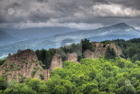To use this stock image in your creative project, please select the size you need over to the right and click the "Add to Cart" button.
Your downloaded image will come with the Cutcaster watermark removed so don’t worry about the watermark you see on this page. Rock formation hdr stock photo, Rock formations - Belogradchishki skali Bulgaria by Desislava Dimitrova