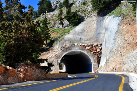 To use this stock image in your creative project, please select the size you need over to the right and click the "Add to Cart" button.
Your downloaded image will come with the Cutcaster watermark removed so don’t worry about the watermark you see on this page. Mountain tunnel stock photo, Travel photography: Mountain road passing through a tunnel in the island of
Crete. by Fernando Barozza
