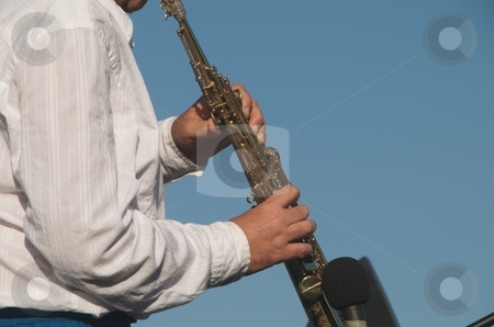 To use this stock image in your creative project, please select the size you need over to the right and click the "Add to Cart" button.
Your downloaded image will come with the Cutcaster watermark removed so don’t worry about the watermark you see on this page. Clarinet Player stock photo, Man playing Clarinet by Timothy OLeary
