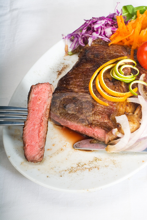 To use this stock image in your creative project, please select the size you need over to the right and click the "Add to Cart" button.
Your downloaded image will come with the Cutcaster watermark removed so don’t worry about the watermark you see on this page. Beef ribeye steak stock photo, Fresh juicy beef ribeye steak sliced ,with lemon and orange peel on top and vegetable beside by Francesco Perre